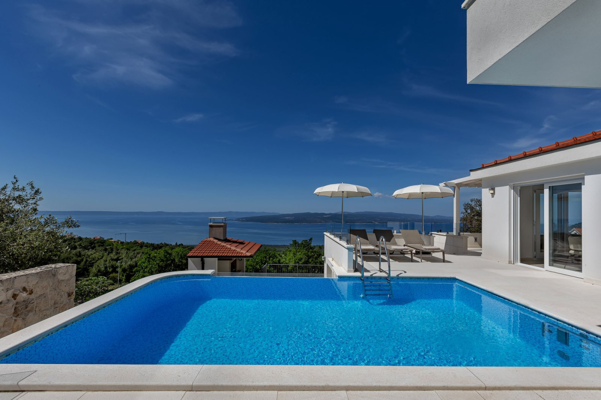 Pool and terrace with parasols overlooking the sea and islands, Villa Prestige near Ba&scaron;ka Voda on the Makarska Riviera